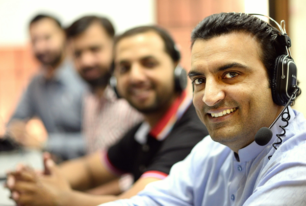 Smiling call center workers from a foreign country