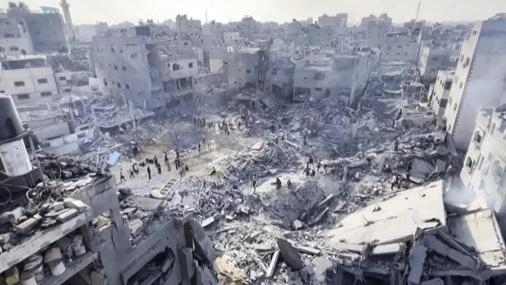 Genocide of Palestinians, destroyed buildings in Rafah by the IDF. buildings shown in rubble while people search for bodies